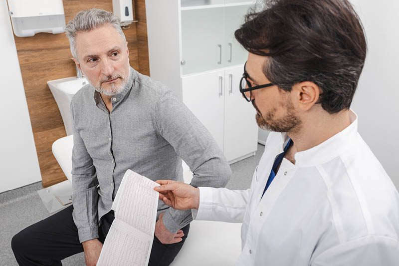 Doctor talking to a man.